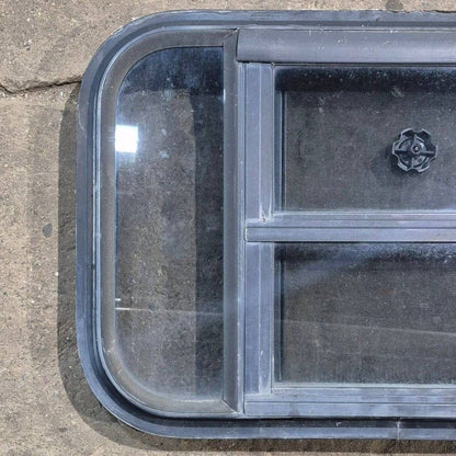 Used Black Radius Opening Window - 23 1/8 X 14 1/2 X 1 7/8